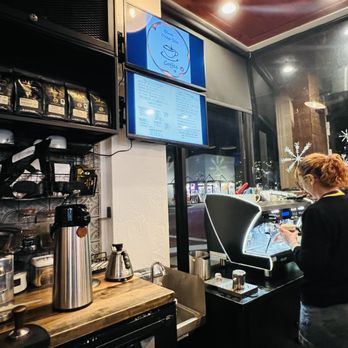 Blue Deep Sea Coffee - a woman working in a coffee shop - Coffee & Tea Near Me - Clermont, Florida