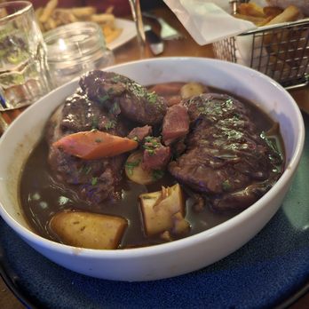 Le Baratin - Coq Au Vin. Roasted half chicken, red wine sauce, assorted veggies, bacon. $36. Excellent version - Cafes Near Me - New York, New York Le Baratin - Coq Au Vin. Roasted half chicken, red wine sauce, assorted veggies, bacon. $36. Excellent version - Cafes Near Me - New York, New York