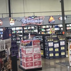 Southside Spirits Liquor Store. - Partial view of store - gift sets to right, beer and wines forefront and Snoop Dogg cutout at Indigo gin display.