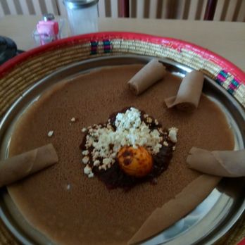 Arif Cafe - Th injera with doro wat. Soooo so delicious. - Ethiopian Near Me - Dallas, Texas