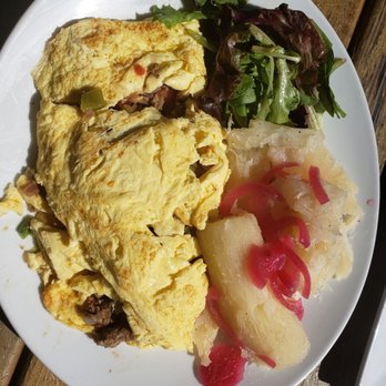 Sofrito Restaurant & Bar - This was just a brunch item. Steak Omelette with a side of Yuca. - Latin American Near Me - Greenville, South Carolina Sofrito Restaurant & Bar - This was just a brunch item. Steak Omelette with a side of Yuca. - Latin American Near Me - Greenville, South Carolina