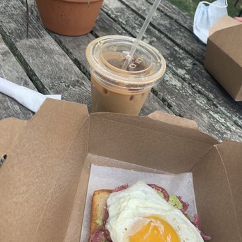 North Fork Roasting - "Bee sting" and avocado toast with a fried egg on top outside on one of the benches. Delicious! - Coffee & Tea Near Me - Southold, New York North Fork Roasting - "Bee sting" and avocado toast with a fried egg on top outside on one of the benches. Delicious! - Coffee & Tea Near Me - Southold, New York