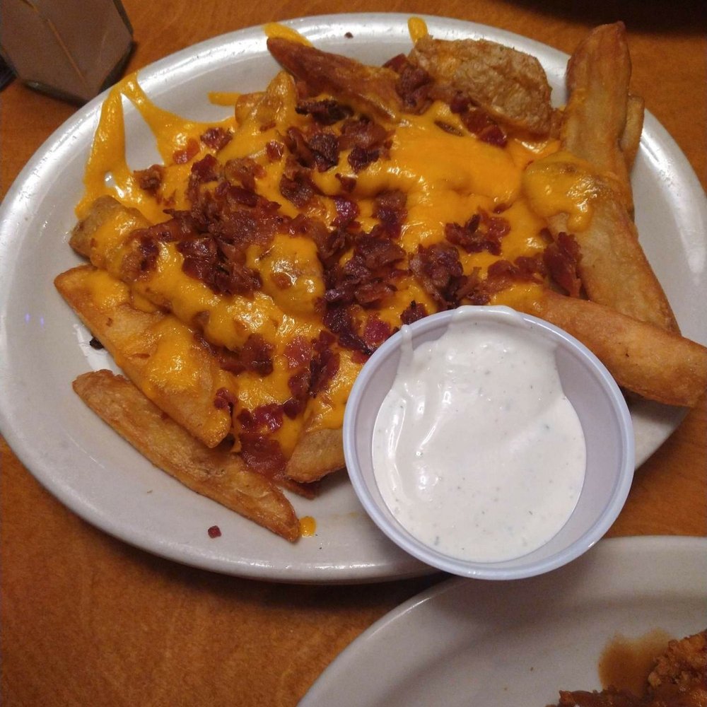 Texas Roadhouse - Loaded steak fries topped with cheese and bacon bits - Steakhouses Near Me - Longview, Texas Texas Roadhouse - Loaded steak fries topped with cheese and bacon bits - Steakhouses Near Me - Longview, Texas