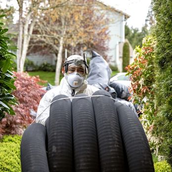 Northwest Crawl Space Services - Worker bringing in new pipes for the sump pump system - Insulation Installation Near Me - Arlington, Washington