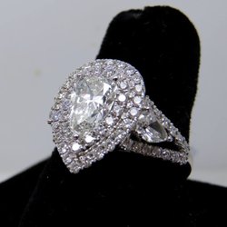 Beifeld Jewelers - Custom made 18kt diamond mounting borders this beautiful diamond stone. If you are looking to update your engagement ring be sure to stop in