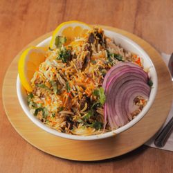 Pataka Indian Fusion Cuisine - Savory, aromatic, and oh-so-delicious! This lamb biryani is the ultimate feast.