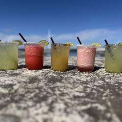 The Cleat Restaurant - House Margaritas; traditional lime, strawberry, peach with tajin rim, raspberry, spicy