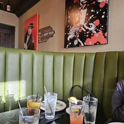 Colorful Paintings of Mobsters on a Wall
