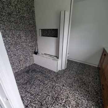 Jamison Remodeling - a bathroom with black and white tile - General Contractors Near Me