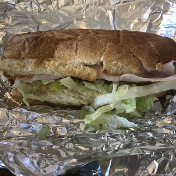 Planet Sub - a sandwich with lettuce and meat - Sandwiches Near Me - Emporia, Kansas