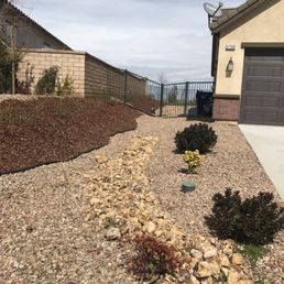 a front yard with gravel and rocks