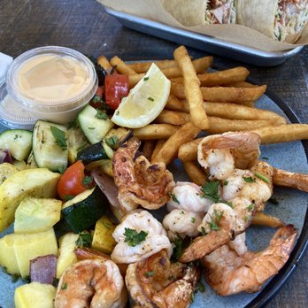 FISH DISTRICT - Plate of the catch of the day (shrimp), fries, and sautéed vegetables - Seafood Near Me - San Diego, California FISH DISTRICT - Plate of the catch of the day (shrimp), fries, and sautéed vegetables - Seafood Near Me - San Diego, California