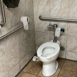 Kroger - Fecal matter in the corner matted to toilet paper.