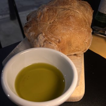 yosteria - a loaf of bread and a bowl of olive oil - Italian Near Me - Pittsburgh, Pennsylvania yosteria - a loaf of bread and a bowl of olive oil - Italian Near Me - Pittsburgh, Pennsylvania