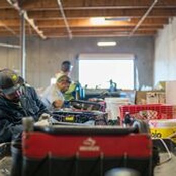 Desert Arc Recycling - workers working in a warehouse - Recycling Center Near Me - Indio, California Desert Arc Recycling - workers working in a warehouse - Recycling Center Near Me - Indio, California