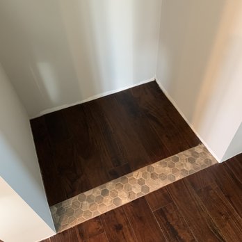 J & R Quality Builders - Tile was installed flush with the existing flooring. - General Contractors Near Me