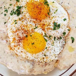 The Mont - Biscuits and gravy with 2 sunnyside up eggs