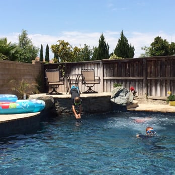 SC Pools & Landscapes - a man diving into a pool - Pool & Hot Tub Service Near Me - Winchester, California