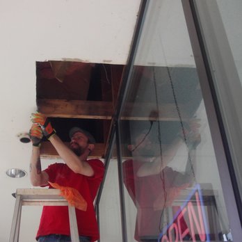 Buddy Who Handyman Services - Before: Hole in overhang of a commercial shopping center. - Handyman Near Me Buddy Who Handyman Services - Before: Hole in overhang of a commercial shopping center. - Handyman Near Me
