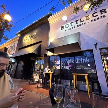 Bottlecraft - a man looking at his cell phone - Beer, Wine & Spirits Near Me - San Diego, California Bottlecraft - a man looking at his cell phone - Beer, Wine & Spirits Near Me - San Diego, California