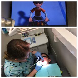 Happy Smiles Kids Dentistry - Laying down for cleaning, they get to watch cartoon. He  lay down still