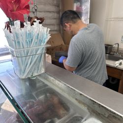 Uncle chopping up the pork by the pound