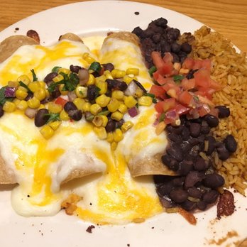 Chili's - Chicken Enchiladas: Topped w/melted cheese, sour cream sauce, corn, black bean salsa & cilantro, & served w/black beans & Mexican rice - Tex-Mex Near Me - Waipahu, Hawaii Chili's - Chicken Enchiladas: Topped w/melted cheese, sour cream sauce, corn, black bean salsa & cilantro, & served w/black beans & Mexican rice - Tex-Mex Near Me - Waipahu, Hawaii