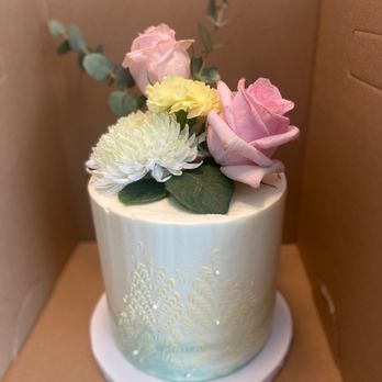 Sweet Sugar Cake - Custom chocolate cake with white butter cream and flower topper. - Custom Cakes Near Me Sweet Sugar Cake - Custom chocolate cake with white butter cream and flower topper. - Custom Cakes Near Me