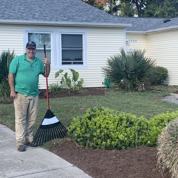 Father and Son Landscaping - My dad, the boss standing next to a perfectly manicured bed! - Landscaping Near Me - Hampton, Virginia Father and Son Landscaping - My dad, the boss standing next to a perfectly manicured bed! - Landscaping Near Me - Hampton, Virginia