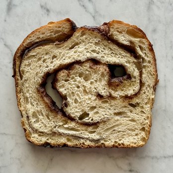 The Lil Bit Bakery - Cinnamon swirl sourdough bread - Desserts Near Me The Lil Bit Bakery - Cinnamon swirl sourdough bread - Desserts Near Me