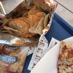 Chips and goldfish with nacho cheese.
