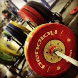 Stone and Barbell Club - Bumper plates on an Olympic bar