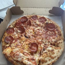 Angelina's Pizzeria & Subs - MESSY AS EVER , I asked for half Pepperoni and I don't know what this is honestly .