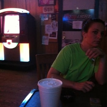The Tavern - a man sitting at a table with a drink - Bars Near Me - Weimar, Texas The Tavern - a man sitting at a table with a drink - Bars Near Me - Weimar, Texas