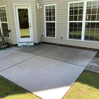 Cardinal Lawn Care - a patio with a concrete patio - Lawn Services Near Me