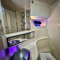 Anchor Glass and Mirror - "After" photo of master bathroom sliding mirror cabinets and vanity mirror in my Bayliner 3988 yacht