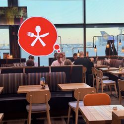 Hausmann's - Haussmann's has servers and table seating with a view of the runway.