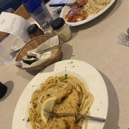 two plates of pasta with chicken two plates of pasta with chicken