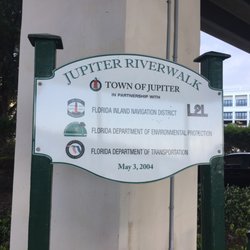 The Plaza Down Under on the Riverwalk - Jupiter Riverwalk sign