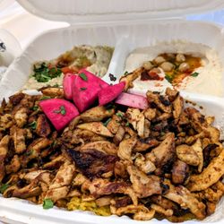 Chicken Shawarma (center). Baba ghanoush (left). Hummus (right)