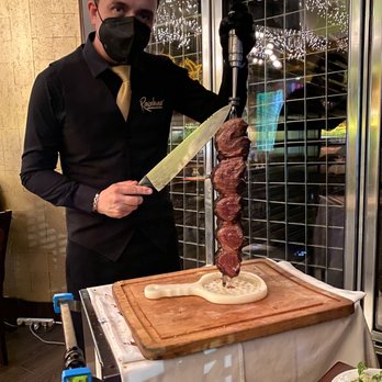Rainhas Churrascaria - Johnny serving beef tenderloin - Brazilian Near Me - Corona, New York Rainhas Churrascaria - Johnny serving beef tenderloin - Brazilian Near Me - Corona, New York