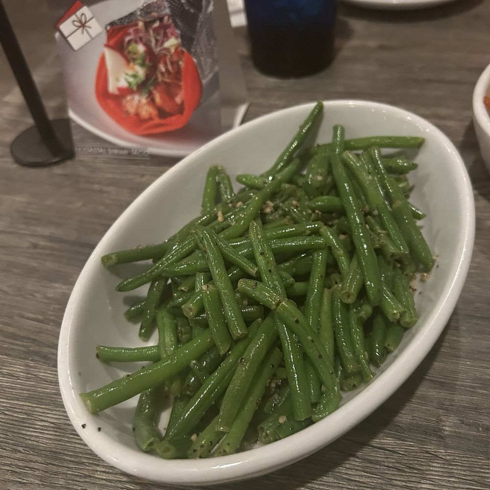 Coastal Grill - Side of Green Beans-lots of garlic and seasoning. Very good if you like them w/ a crunch. - American Near Me - Galveston, Texas Coastal Grill - Side of Green Beans-lots of garlic and seasoning. Very good if you like them w/ a crunch. - American Near Me - Galveston, Texas