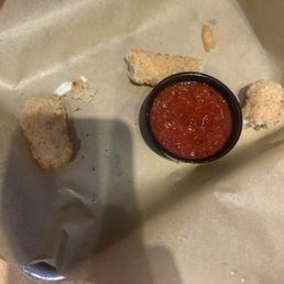 Uncooked mozzarella sticks nearly frozen Uncooked mozzarella sticks nearly frozen