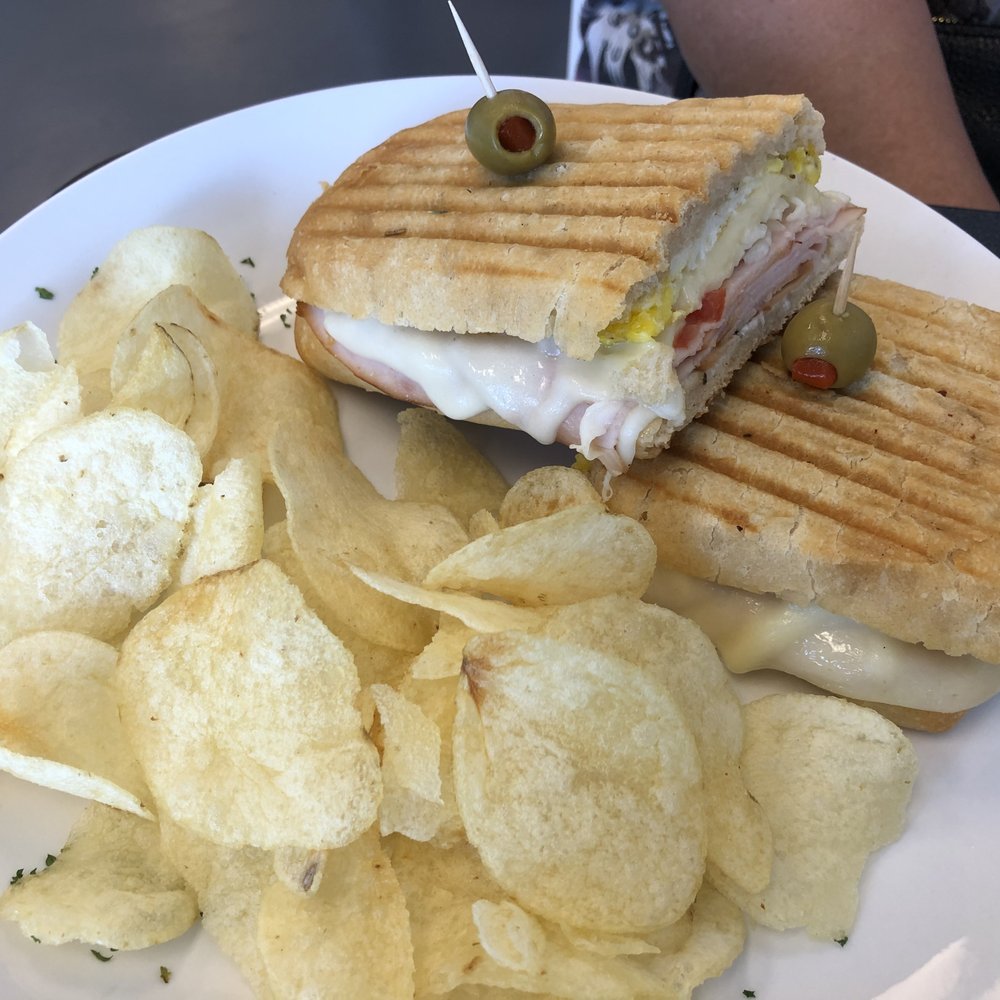 Cafe Flore - Turkey Panini with chips - Breakfast & Brunch Near Me - Fort Myers, Florida Cafe Flore - Turkey Panini with chips - Breakfast & Brunch Near Me - Fort Myers, Florida