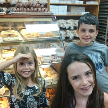 Don's Bakery of Bala - a boy and a girl in front of a display of donuts - Bakeries Near Me - Bala, Ontario Don's Bakery of Bala - a boy and a girl in front of a display of donuts - Bakeries Near Me - Bala, Ontario