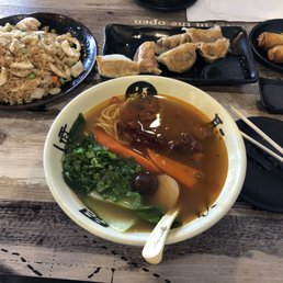 Egg rolls, pan fried dumplings, and spicy beef noodle soup