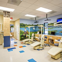 Coastal Kids Dental & Braces - Moncks Corner - TV's above the hygiene bay chairs