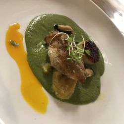 Blue 11 - Deconstructed Callaloo Soup with Pan seared grouper, mussels, & scallop, boiled ripe plantain, and annatto oil
