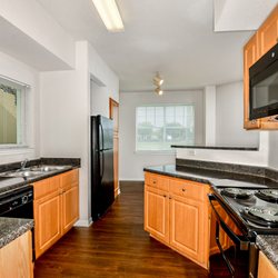 Cypress Legends - Kitchen has electric appliances including dishwasher, and double stainless steel sink