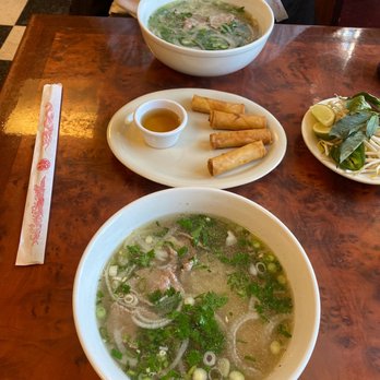 Pho Boston - Sliced beef pho with all the fixings on the side, and veggie spring rolls. - Vietnamese Near Me - Florence, Massachusetts
